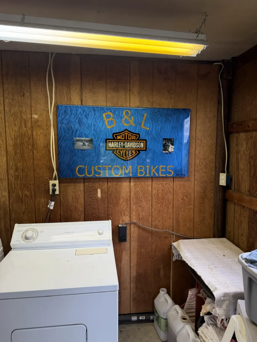 B & L Custom Bikes resin sign on the shop wall