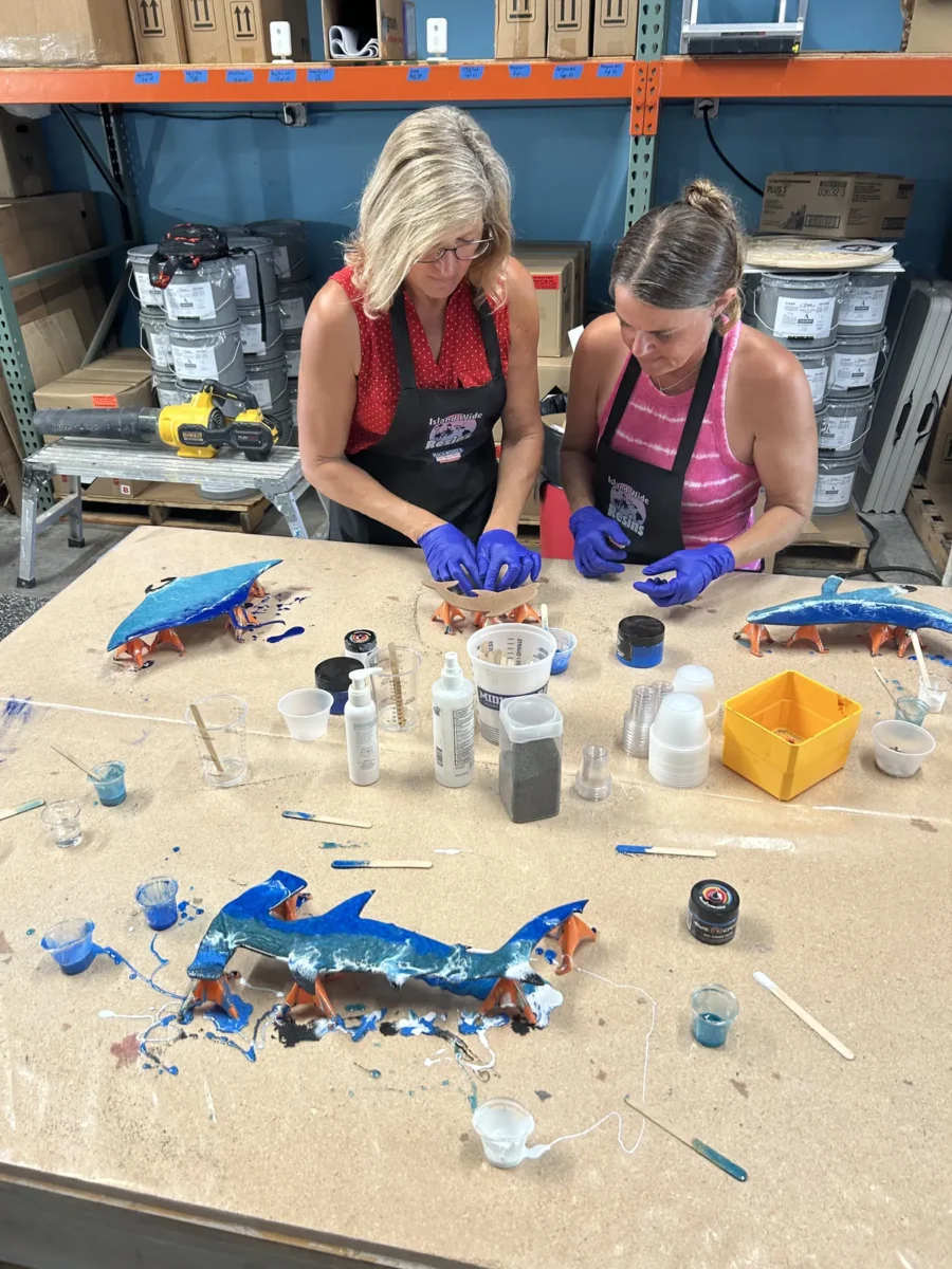 Friends creating resin art at a private party