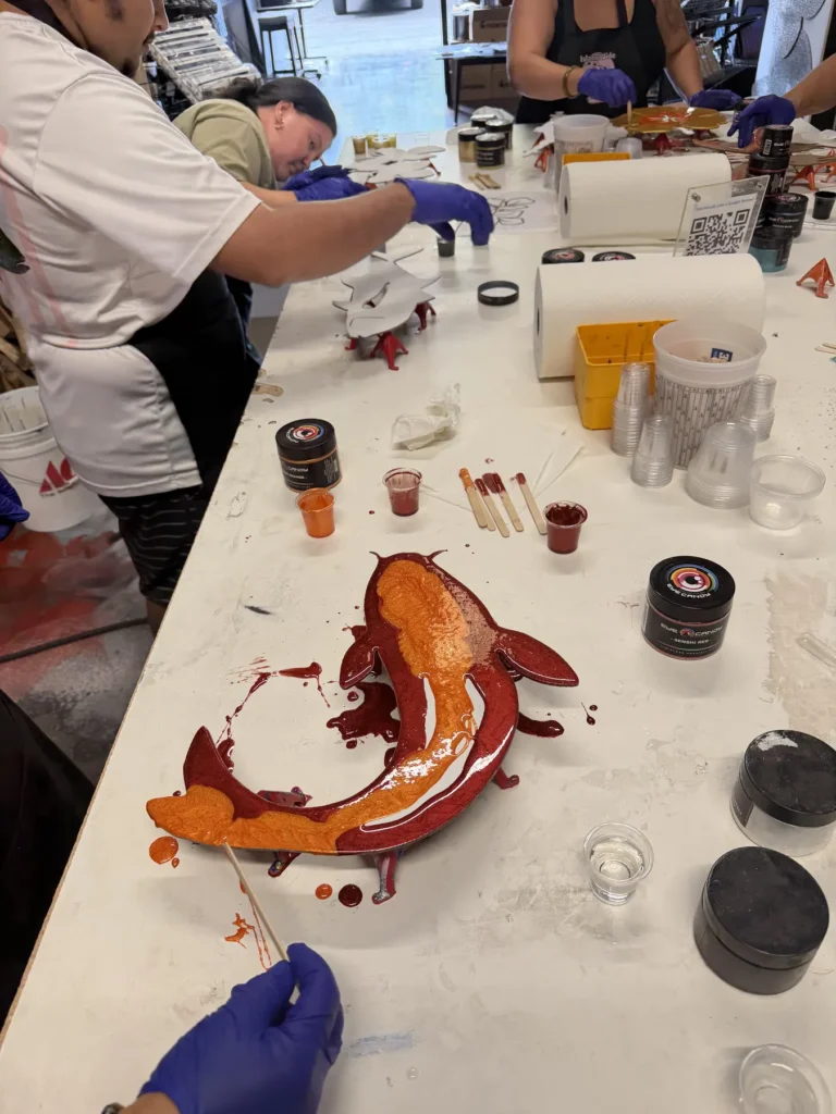 Koi cutout being colored during a class