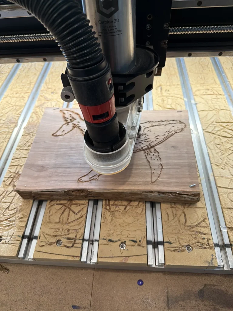 CNC router carving a wood slab