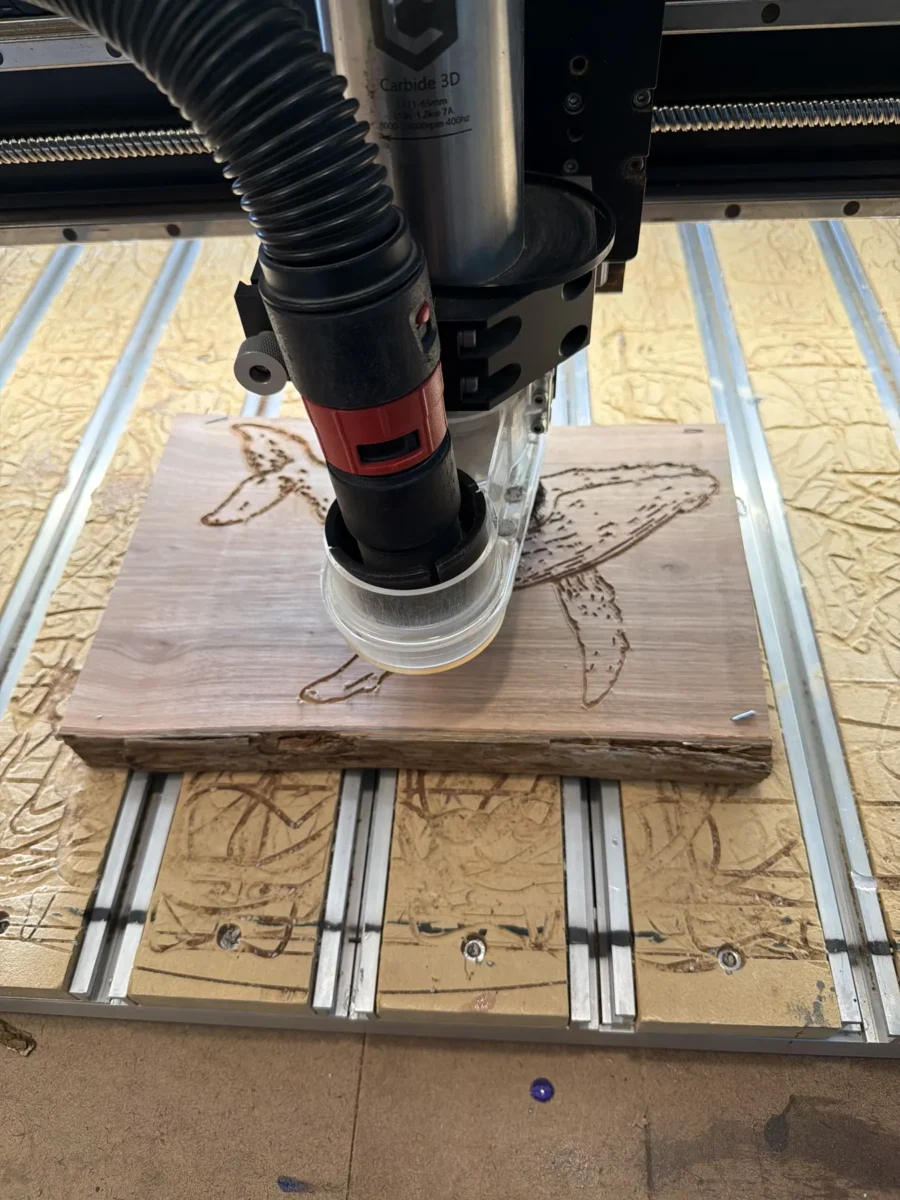 CNC router carving a wood slab