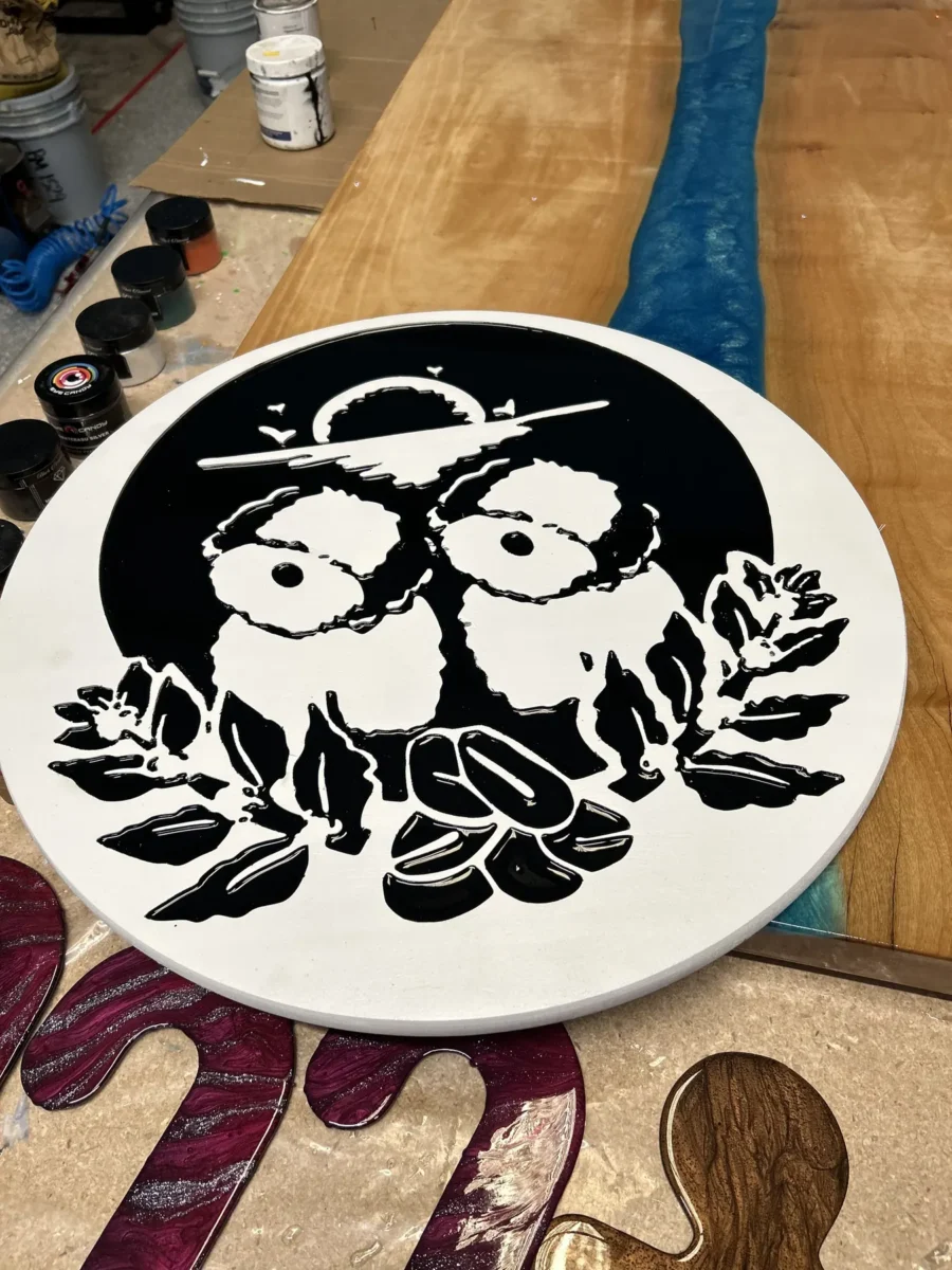 Round CNC-carved sign with resin