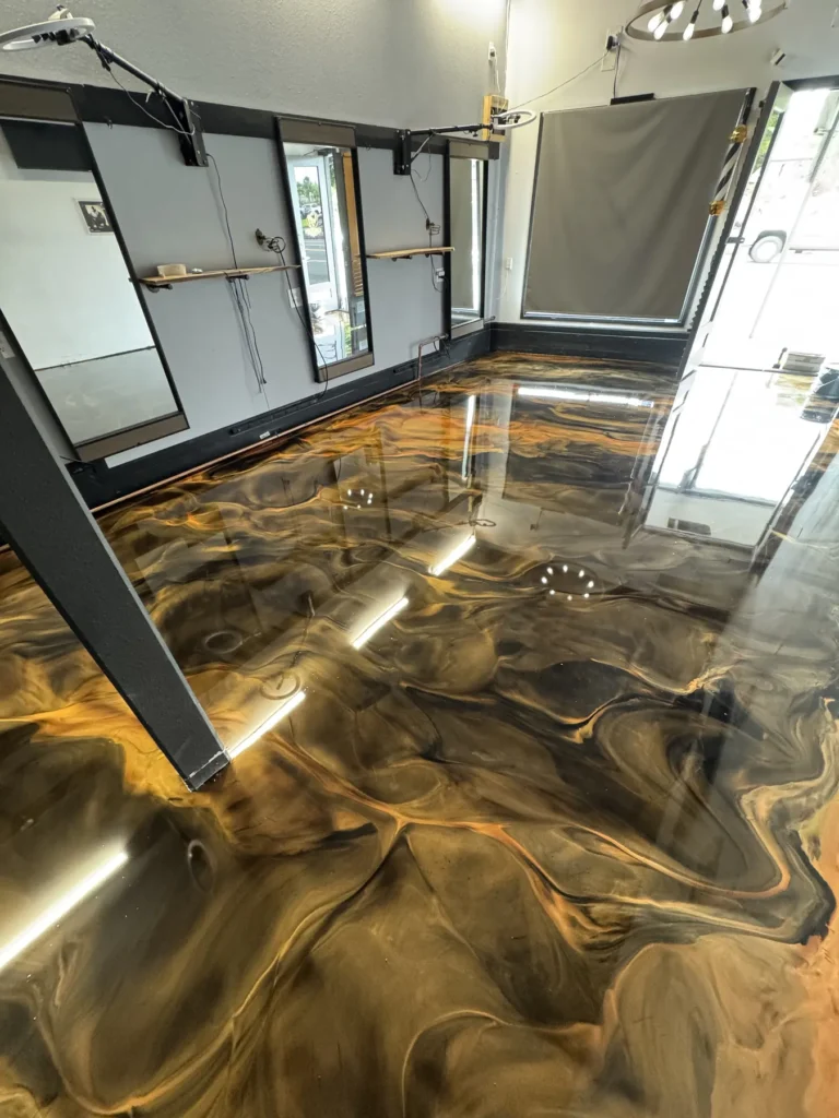Metallic epoxy floor with gold and black movement