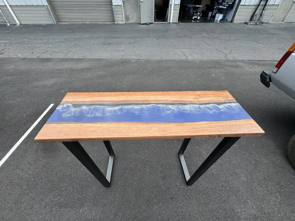 Resin table with a blue river