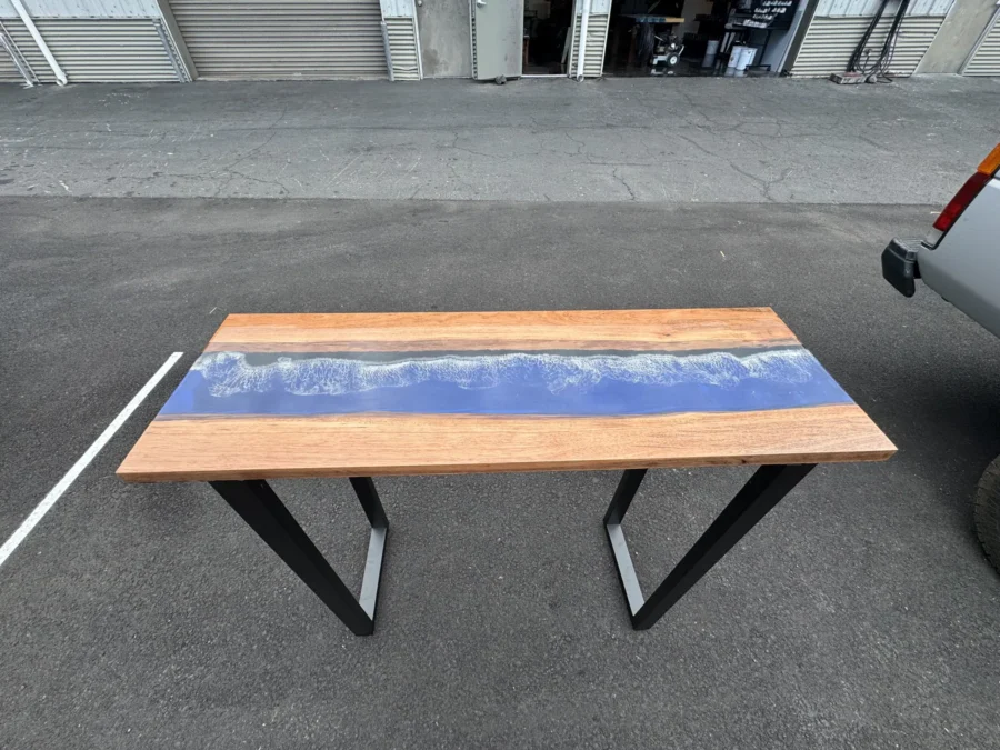Resin table with a blue river