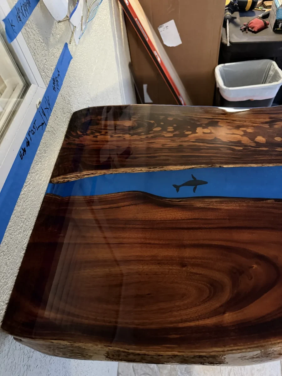 Walnut-tone slab table with blue resin