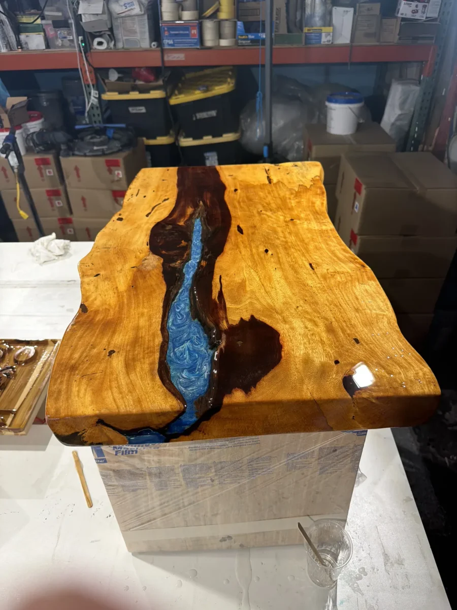 Live-edge table with a golden resin river