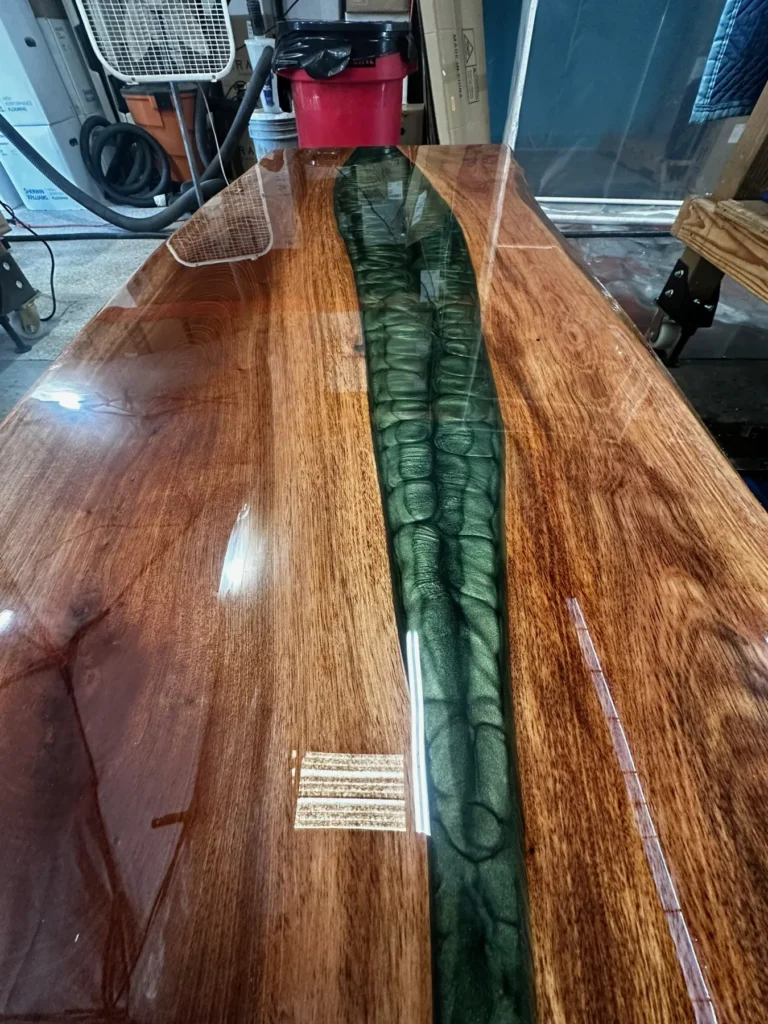 Live-edge slab table with a green resin river