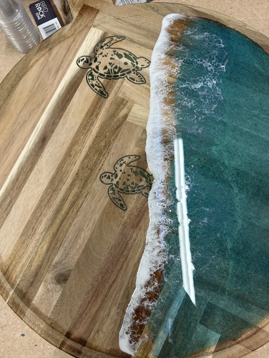 Round wood piece with an ocean resin pour