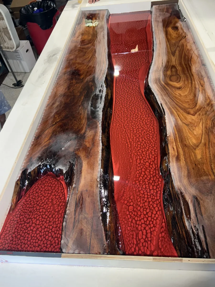 River table during a red resin pour